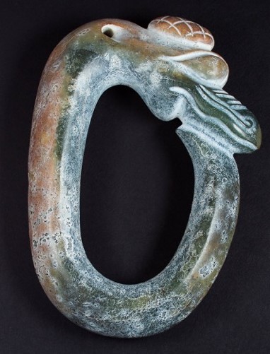 C-dragon with raised relief.