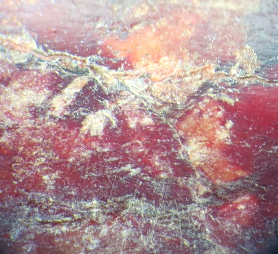 With Clay mineral and crack on the crust.