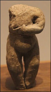 Pregnant woman clay figerine.